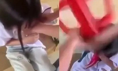 Nữ sinh lớp 8 bị bạn dùng ghế đánh vào đầu, cởi áo giữa lớp